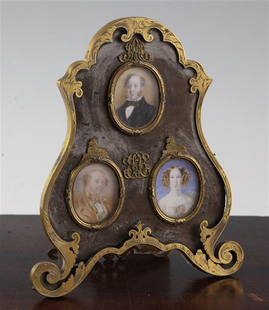 Three Victorian oil on ivory portrait miniatures of members of the Huggins family (Lion Brewery), overall 7.75in.